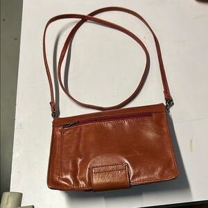 Danier Tan Leather Crossbody Bag with Sleek Design